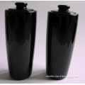 black colored glass bottle